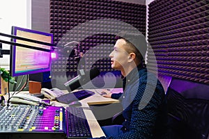 a radio host conducts a live broadcast in a professional radio studio.