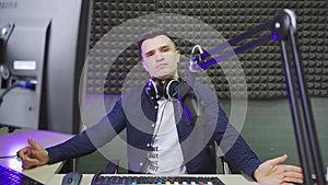 a radio host conducts a live broadcast in a professional radio studio.