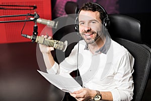 Radio host moderating at on air talk show