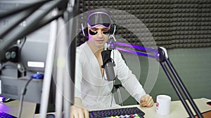 radio host in sleep mask and cosmetic patches on broadcast