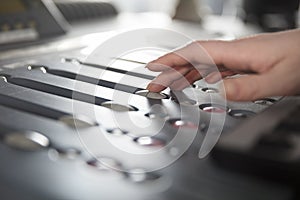 Radio Host Using Music Mixer In Studio