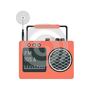 The radio is orange, vintage, with a radio wave on a small screen, a pressed button, an antenna and a carrying handle.