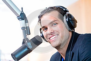 Radio presenter in radio station on air