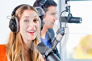 Radio presenters in radio station on air