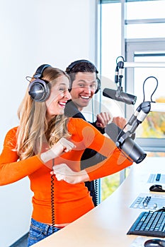 Radio presenters in radio station on air