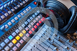 Radio station: Headphones on a mixer desk in an professional sound recording studio