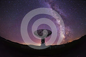 radio telescope on the background of stellar tracks