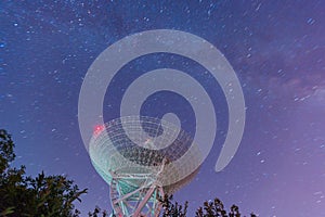 Radio telescope at the night sky