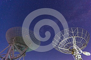 Radio telescope at the night sky