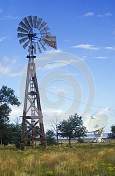 Radio telescope and old windmill at the National Radio Astronomy Observatory in Socorro, NM