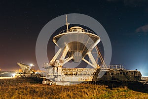 Radio telescope satellite antenna at starry night