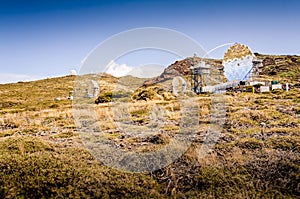 Radio telescopes on a mountain. Mirror telescope. Astronomy observatory. Telescope domes. Dark sky site. MAGIC telescopes. Roque