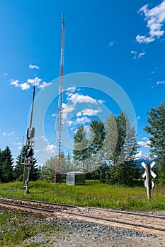 A radio tower next to railroad tracks in British Columbia, Canad