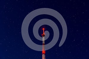 Radio tower on night starry sky background