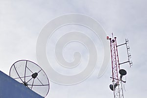 Radio Transmitter Satellite Speaker.Broadcasting tower in the village.Atop a bright sky background