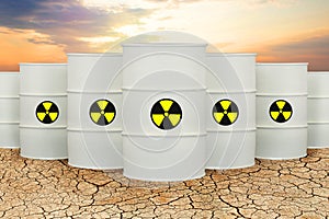 Radioactive waste tanks against sky clouds. Radioactive waste barrels. Environment protection and toxic nuclear pollution concept