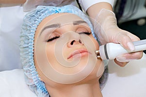 Radiofrequency facial skin lifting photo