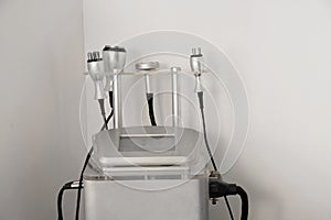 Radiofrequency lipolaser ultrasound machine and space harvester in a beauty salon on a white background