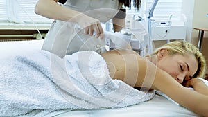 Radiofrequency treatment woman in day beauty spa salon