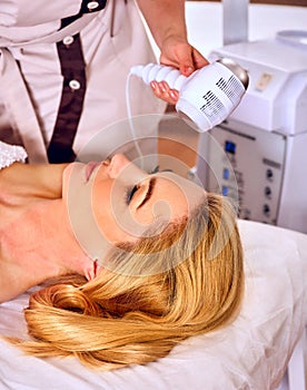 Radiofrequency treatment woman in day beauty spa salon photo