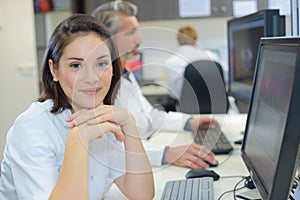 Radiographer posing in front computer