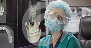 Radiologist Dentist Doctor video portrait at teeth 3D x-ray On Desktop Computer Monitor