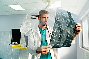 Radiologist, doctor examining x-ray images of patient for diagnosis