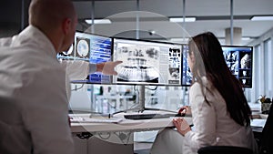 Radiologist Doctors Analyzing Brain MRI Scan