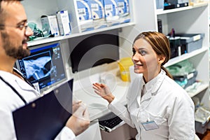 A radiologist looks at an x-ray image in his lab