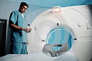 Radiologist Setting MRI Scanner