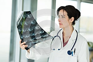 radiologist woman checking x ray