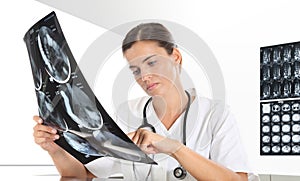 Radiologist woman checking xray, healthcare
