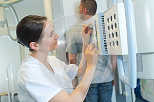 Radiologists setting xray machine setting