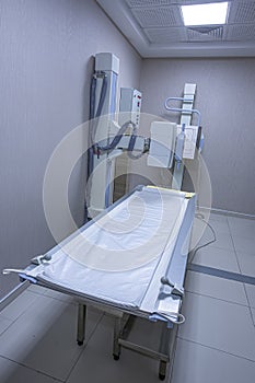 Radiology Device. x-ray machine at the hospital, An irradiated radiation emitting device to the patient