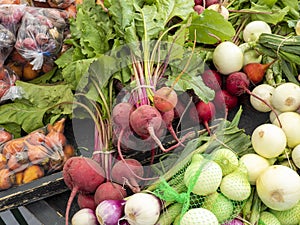 Radishes and assorted vegetables on display for sale at the local market