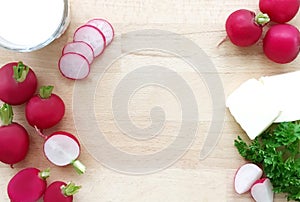 Radishes. Ingredients for radish spread or radish soup - radishes, butter, cream and green parsley.