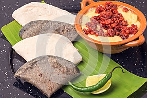 Raditional Mexican food gourmet melted cheese with chistorra and corn tortillas