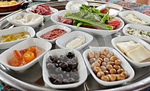 Ð¢raditional turkish breakfast-cheese, olives, vegetables, yogurt, candied fruit, jam