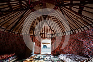 raditional Uzbek yurt inside. Interior decoration of the yurt. Living room with stove photo