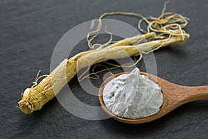 Radix Ginseng root next to White rice and Chinese Ginseng clarifying polishing facial mask in wooden spoon