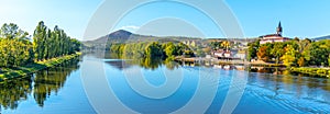 Radobyl Mountain in Ceske Stredohori, Central Bohemian Uplands. View from Labe River in Litomerice, Czech Republic photo
