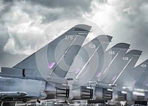 RAF Coningsby Modern Typhoon Eurofighter military combat jet fighters aircraft stationary five in a row with engines running heat