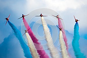 RAF Red Arrows aerobatic demonstration team performing at the Sanicole Airshow during sunset. Belgium. September 10, 2021