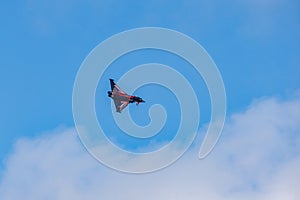 The RAF Typhoon, callsign Blackjack flies against a bright blue sky