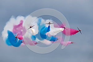 Royal Air Force RAF Red Arrows formation aerobatic display team flying British Aerospace Hawk T.1 Jet trainer aircraft.