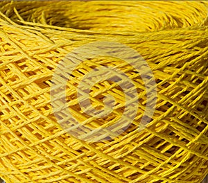 Raffia close-up.A skein of yellow raffia is ready for knitting. Eco-friendly handmade material