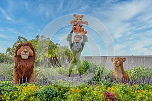 Rafiki, Simba, Mufasa and Nala character topairy displayed at Epcot