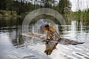 A raft with a bright burning fire