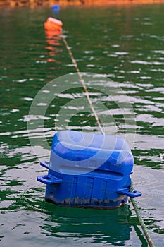 Raft a flat buoyant structure of plastic box used as a floating platform for territory