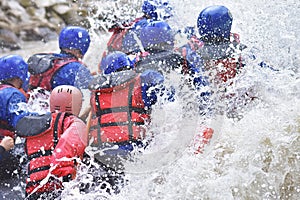 Rafting team splashing